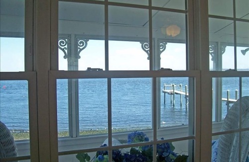 Bristol Cottage | Old fashioned designer front porch living by the sea with expansive water views.