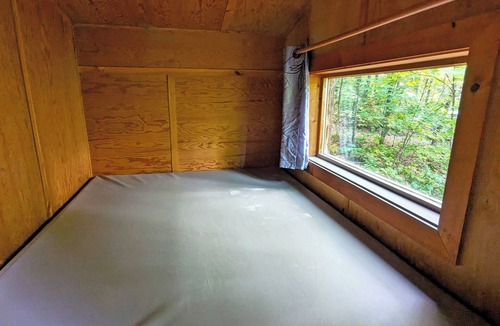 Saint-Faustin-Lac-Carre House | Perched treehouse with a tree growing through the deck | Lodging #08