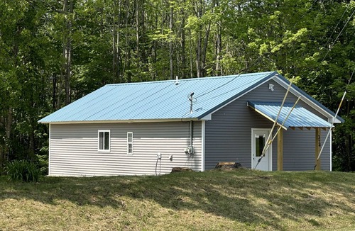 Dexter Cabin | Rail Trail Retreat! Recently remodeled cozy home on Snowmobile/ATV Trail!