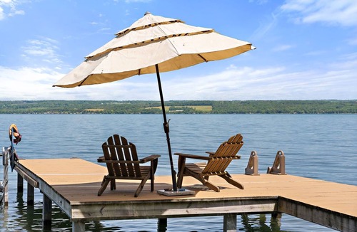 Romulus House | Relax at Poplar Beach Retreat on the sparkling waters of Cayuga Lake. This charming waterfront escape combines rustic character with bright, comfortable living spaces, creating the perfect setting for a relaxing Finger Lakes getaway.