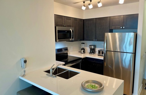 Toronto Entertainment District Condo | Roger’s Center- Downtown large two bedroom + den facing waterfront by CN Tower,