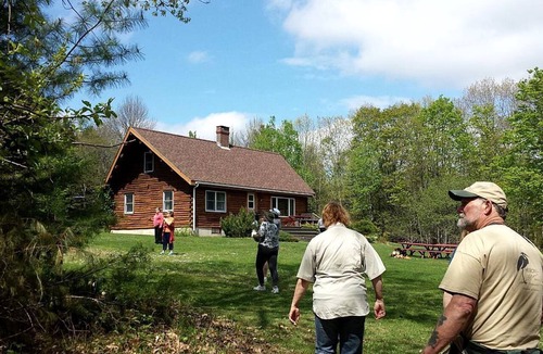 Exeter Cabin | Rustic Camping Cabin with Fireplace in Private Woods near Bangor, Maine