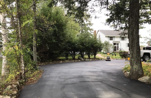 Northwood House | Rustic Lake front cottage nestled in the pines with a Golf Putting Green.