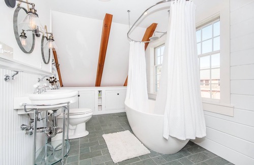 Ipswich House | Rustic Luxe FarmHouse a Few Miles To Crane Beach: deck &jacuzzi overlooking pond