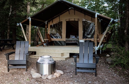 North Woodstock RV Rental | Safari Tent Site 6 | 1 Queen Bed & 1 Twin Bed | Pond View