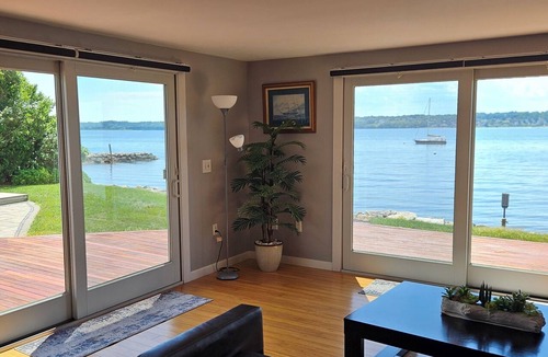 Tiverton House | Sapowet Cove direct beach access sitting on deck watching spectacular sunset.