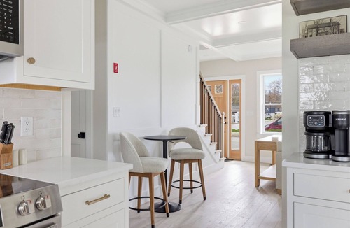 Kennebunk Apartment | Seaside luxury meets unbeatable location. This stylish 2BR/2BA retreat is steps from Dock Square KPT's restaurants, shops, and galleries, and includes beach gear and a private fire pit.