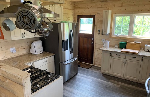 Prince County Cottage | Semi-private beach, huge screened deck, woods on fenced property