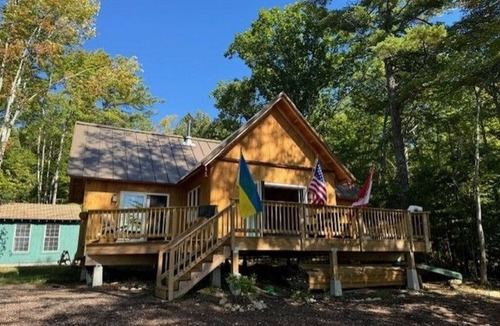 Barndoor Island Cottage | Serene 2-bedroom cottage with detached bunk house for relaxing stays.