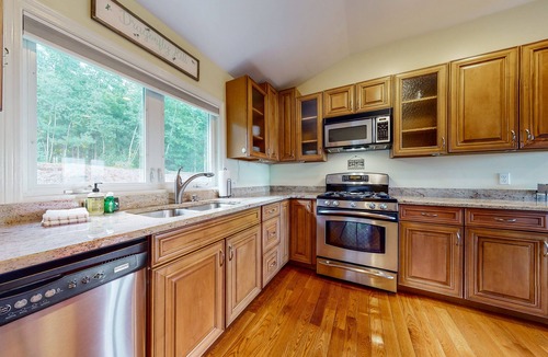 Gilford House | Single-story home overlooking Lake Winnipesaukee with firepit, fireplace & WiFi
