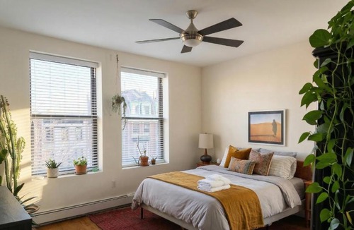 East Harlem Apartment | Sunlit Luxury 2BR Harlem Brownstone Retreat - Near Express Trains