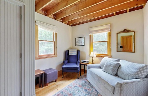 Warren House | Sunny, lakefront home on South Pond with private dock, great deck & firepit