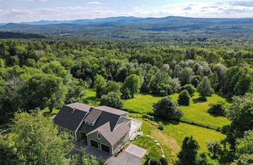 Center Ossipee House | Sunset Slopes: A spacious 4-bedroom home in scenic Wilmot, NH, with garden views.