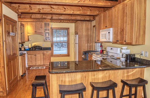 Belmont Ski Chalet | The Whimsical Chalet is a lovely cape on acres. Private setting less than 10 minutes to skiing.