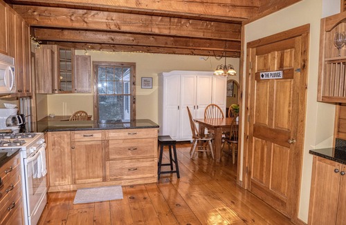Belmont Ski Chalet | The Whimsical Chalet is a lovely cape on acres. Private setting less than 10 minutes to skiing.