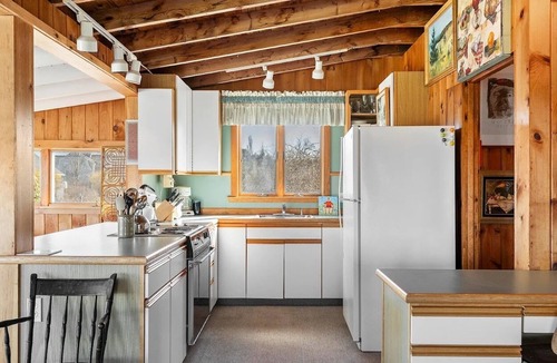 Mid-Coast and Islands Cottage | The Yellow Cottage is a 2-bedroom little getaway located right on its own private beach.