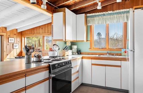 Mid-Coast and Islands Cottage | The Yellow Cottage is a 2-bedroom little getaway located right on its own private beach.