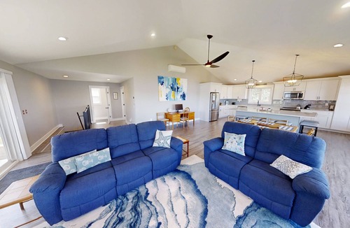 Mid-Coast and Islands House | This spacious home offers a FANTASTIC covered porch, perfect to spend your days gazing at the ocean!