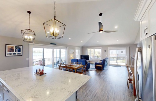 Mid-Coast and Islands House | This spacious home offers a FANTASTIC covered porch, perfect to spend your days gazing at the ocean!