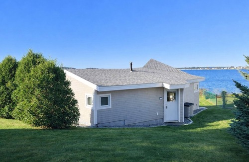 Mid-Coast and Islands Cottage | This sweet cottage offers a shared pebbly beachfront and gorgeous sunset views