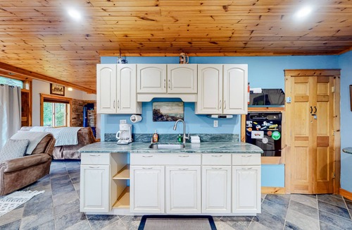 Mount Holly Apartment | Three-level dog-friendly getaway with a private hot tub, fireplace, & W/D