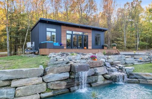 Brackney House | Tiny House on a Waterfall at Private Tiny Lake