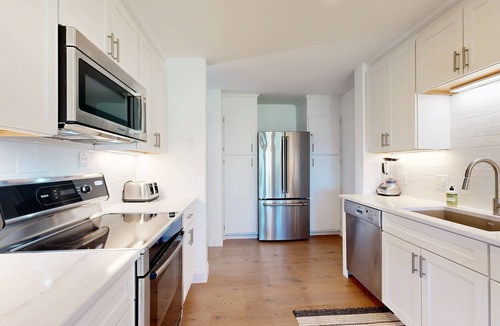 Gilford House | Tranquil lakeside retreat with beach access, pool, firepit, & lovely patio views