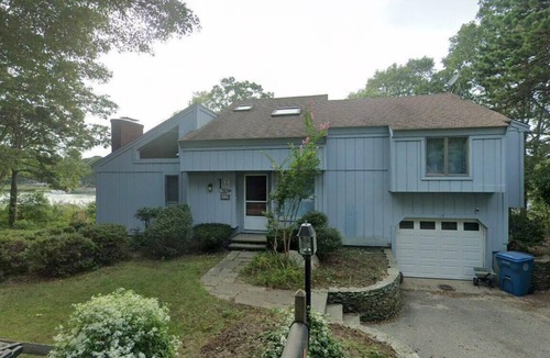 East Falmouth House | Tranquil Waterfront Retreat dock perfect Family Getaways 7 min drive to beach