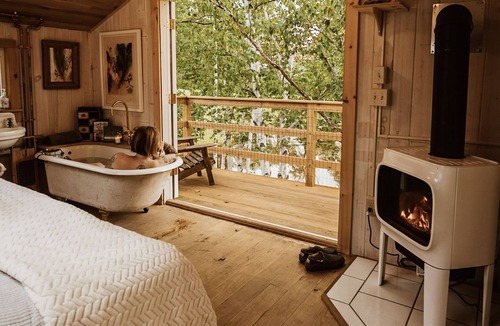 South Londonderry Cabin | Treehouse lifted up over a stocked trout pond up in the beautiful birch trees!
