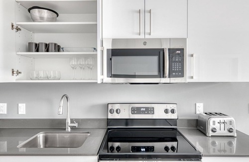 St. Elizabeth's Apartment | Trendy Brighton 1BR w/W/D, Gym, near T, Shops + Dining, by Blueground