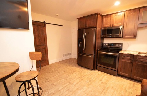 Geneva Bed & Breakfast | Two Bedroom North Condo at our Lakefront Paradise. Pool, Hot Tub, Kayaks and more. (Sleeps 4 Adults)