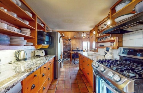 Newbury House | Two-story riverfront retreat with a furnished deck, views, & washer/dryer