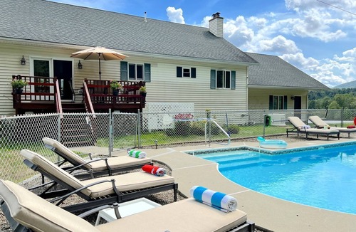 Johnsburg House | Unique Glamping Rental near Mt.Gore, New York, with Hot Tub, Heated Pool, and Playroom