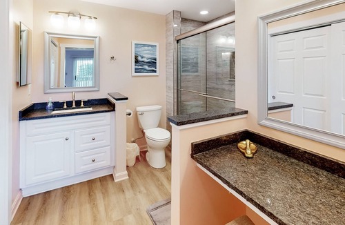 Heron Harbour Isle Condo | Updated Bayfront Condo w/ Canal Views, Balconies, Shared Pools - Walk to Beach