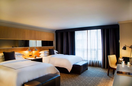 Bloor-Yorkville Hotel | Urban Sophistication: Spacious Rooms, Close to Arts Scene and Attractions