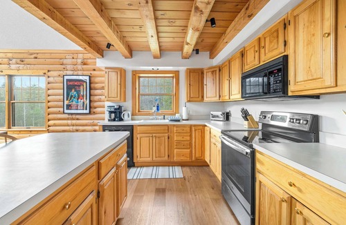 Weston House | Vermont Log Cabin, Stone Fireplace & Forest Deck