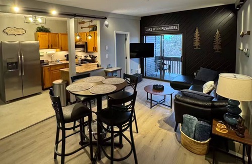 Weirs Beach Condo | Walk to Weirs Beach Boardwalk with Treetop Views of Lake Winnipesaukee!