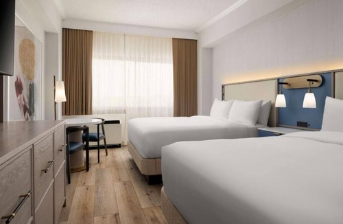White Plains Hotel | Warm and Comfortable Pets Allowed Two Queen Room w/ Pool and Airport Shuttle