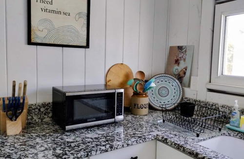 Phippsburg Cottage | Watch the sunshine dancing off the ocean in this quaint ocean front cottage.