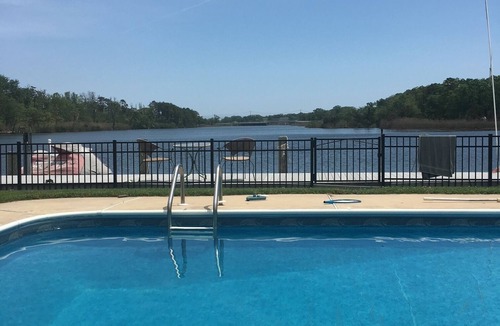 Brick House | Waterfront views from the pool
