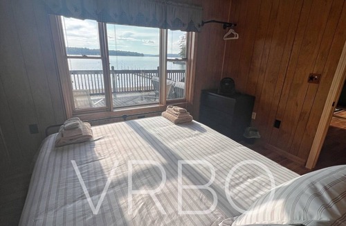 Gilford House | Winnipesaukee Beach house sits on 100’ of frontage and includes a dock slip