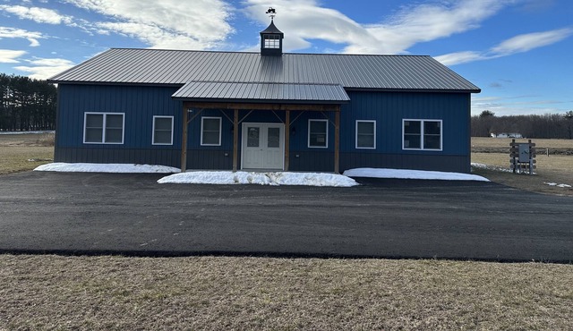 A brand new apartment inside a barn building located on a farm.