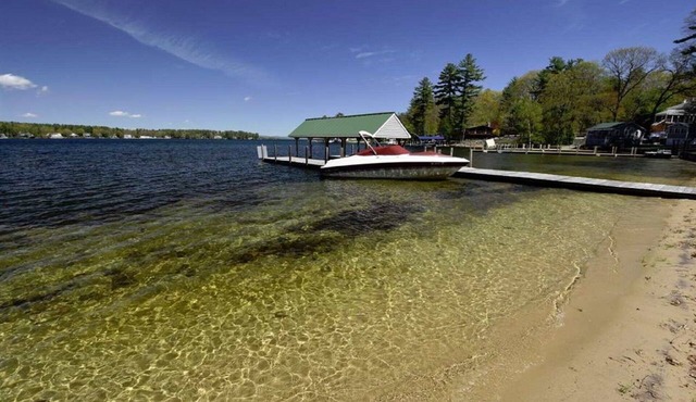 Beautiful Lake Winnipesaukee waterfront, beach and dock.