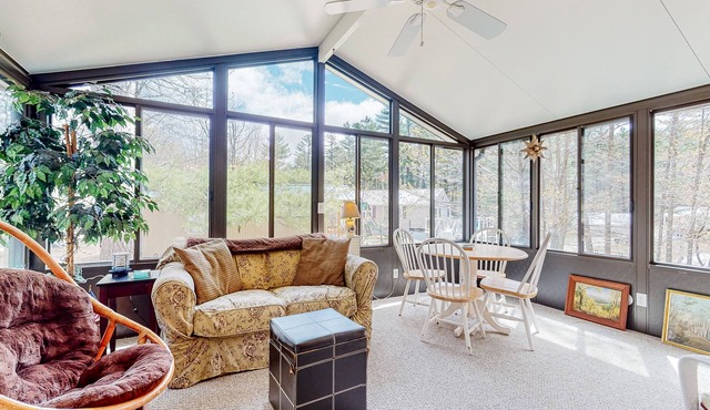 Calming dog-friendly lake view home with firepit, wood stove, patio, & gas grill