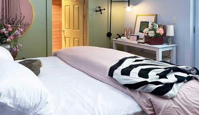 Cozy Carriage House room with a double bed and private balcony