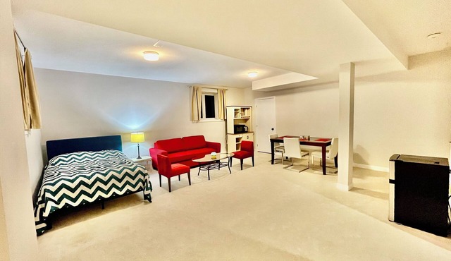 Entire basement with large windows, private full bathroom and office