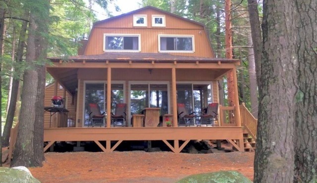 Famous cottage directly on 100' private shoreline of pristine lake.