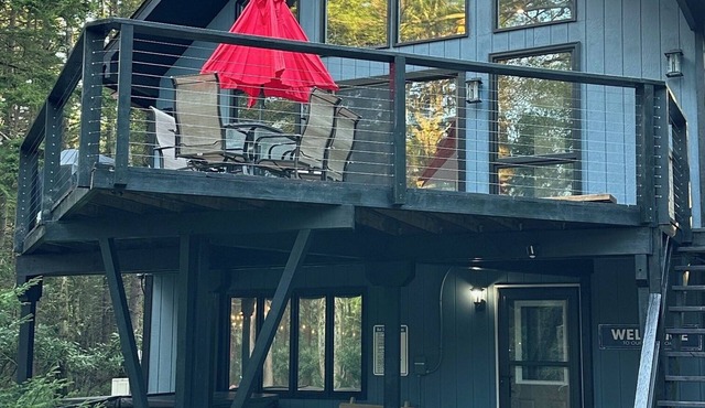 Lake Chalet Private Beach Hot Tub Fire Pit Skiing Golf Walkable to the Lake.