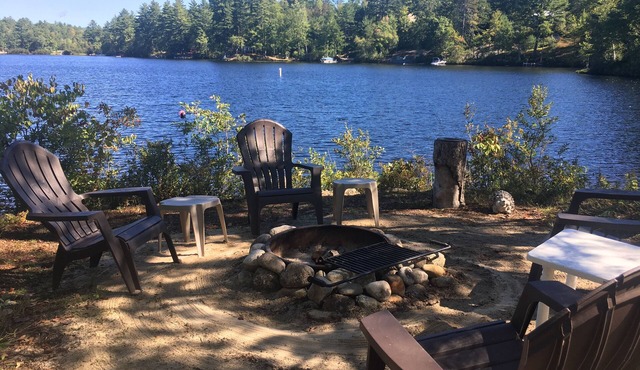 Lake Ossipee New Hampshire waterfront cabin with beach, dock, fire pit, privacy.