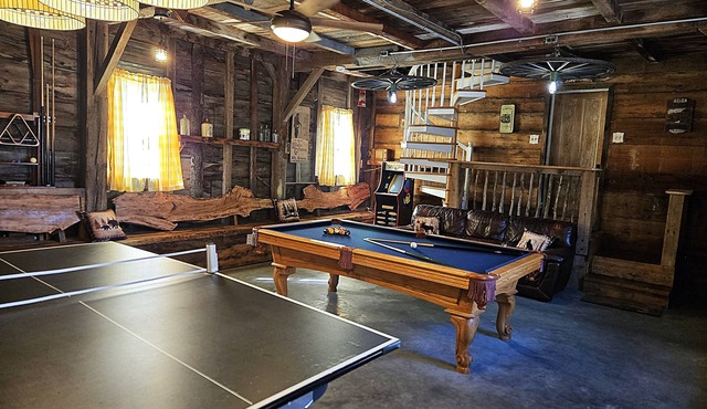 Large rustic home with gameroom. Near lakes, skiing, walk to downtown.